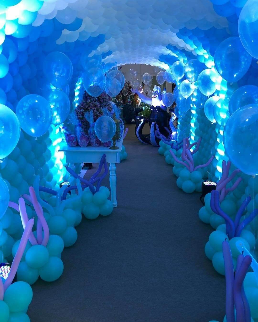 Blue LED balloon tunnel entrance decoration with glowing lights and immersive walkway setup for luxury events