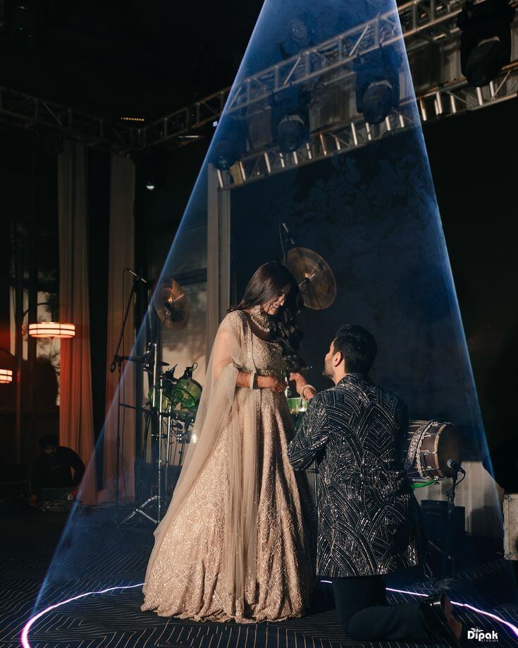 Luxury engagement ceremony setup with elegant stage decoration and professional event planner.